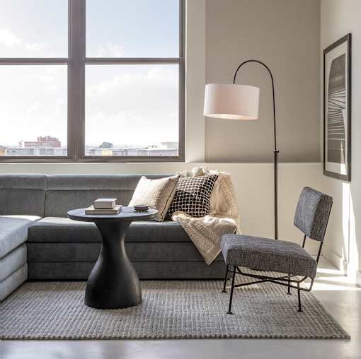Grey couch and black table at Lofts at Centennial Yards, Atlanta