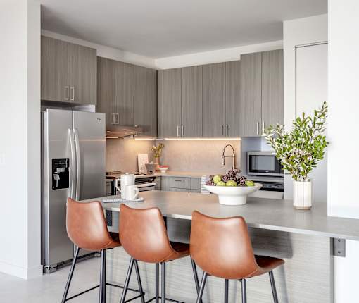 Kitchen with island at Lofts at Centennial Yards, Atlanta, Georgia