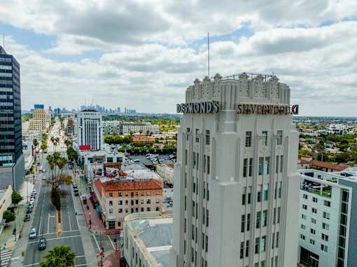 A view of a city from a high vantage point with a building named Silverado in the foreground.