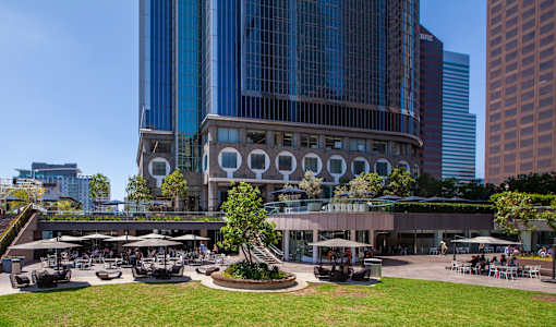 A large building with a circular courtyard in front of it.