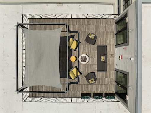A top view of a dining area with a table, chairs, and a hanging cloth, 28 Austin, Newton, Massachusetts