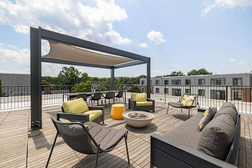 A patio with a table and chairs under a canopy, 28 Austin, Newton, Massachusetts