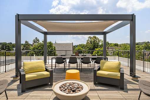 A patio with a fire pit and chairs, 28 Austin, Newton, Massachusetts