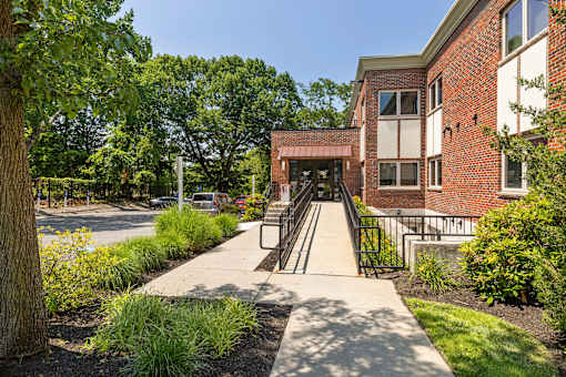 Ramp and sidewalk to exterior entrance at 735 Truman, Hyde Park, Massachusetts