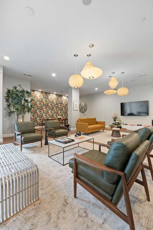 A living room with a green sofa and a yellow sofa.