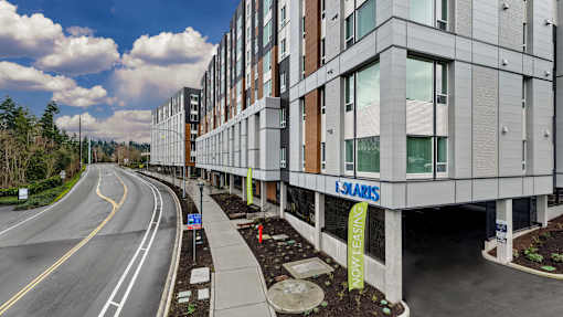 A modern building with the sign "LSJARIS" on the side.
