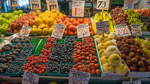 A fruit stand with a variety of fruits on display.