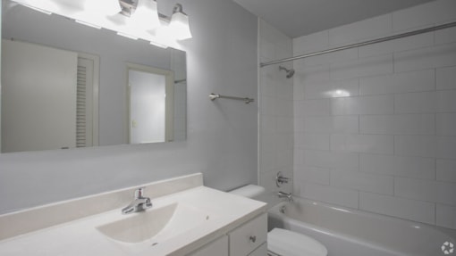 a bathroom with a sink toilet and bathtub