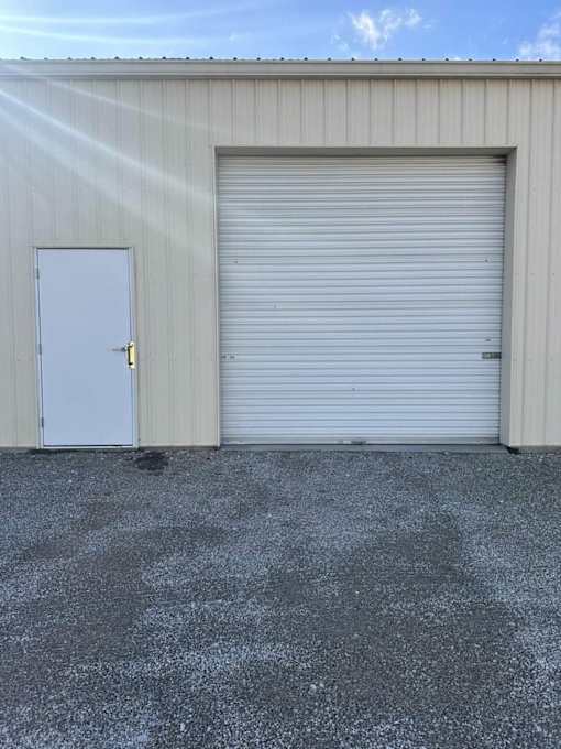 A large white garage door is closed.