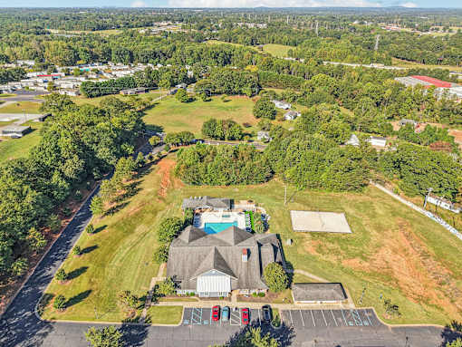 A large house with a pool in the backyard.