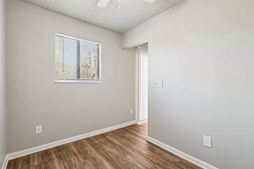 A room with a window and wooden flooring at Grand  Valley Apartments, Milford, OH
