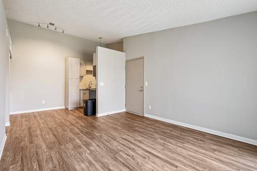 A room with wooden flooring and a white door at Grand Valley Apartments, Ohio, 46150
