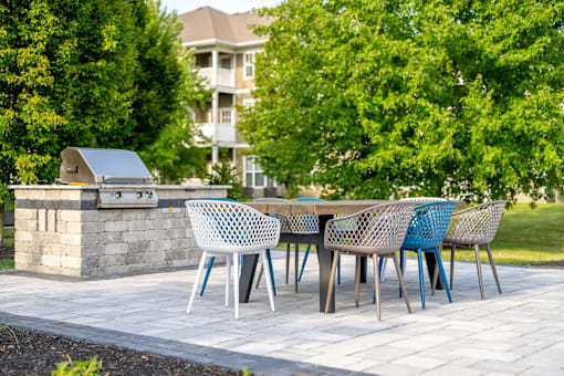 A table with chairs is set up outside.
