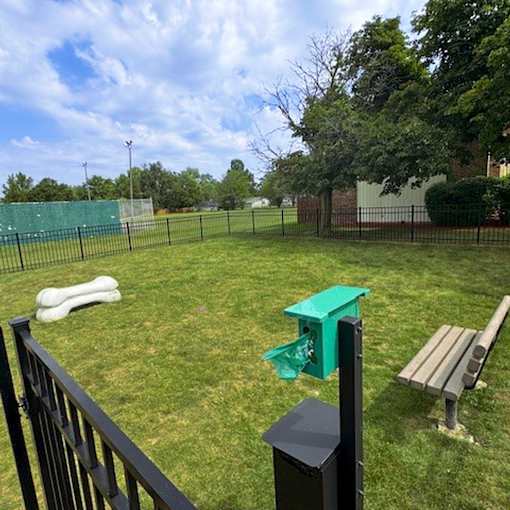 Clean dog park with a bench with fence at Black Hawk Apartments, Fort Wayne, IN, 46815
