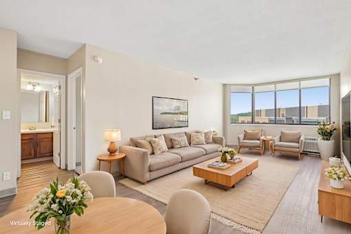Virtually staged Irvine Park Towers apartment living and dining room with neutral furnishings