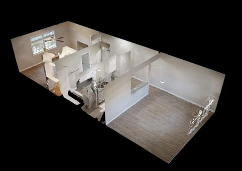 A 3D image of a house interior with a kitchen, living room, and bathroom.