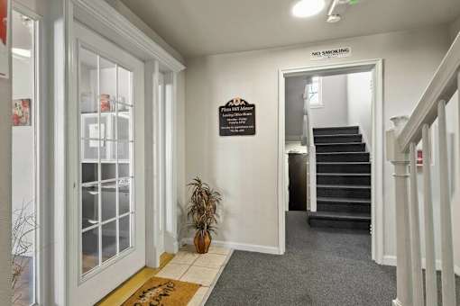 A hallway with a sign that says