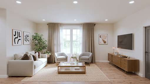 A living room with a couch, chair, and a television.