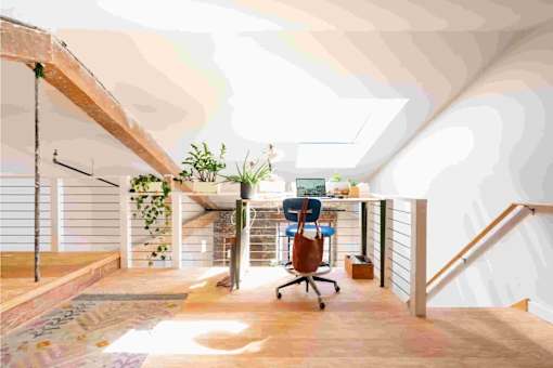 A room with a desk and a chair is shown.