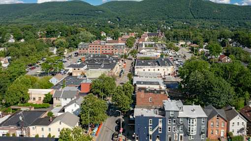 A small town with a large building in the middle of it.