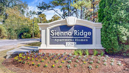 A sign for Sienna Ridge Apartment Homes with a number 2283 on it.