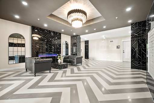 A large, open room with a black and white chevron patterned floor.