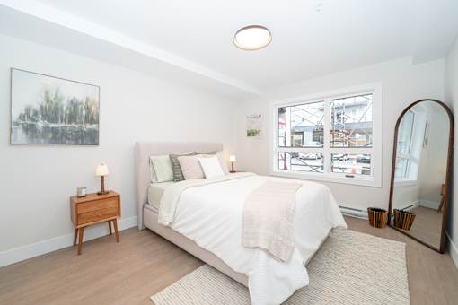 Bedroom with a Nightstand at Woodland Place Apartments, British Columbia, L4H 3P6