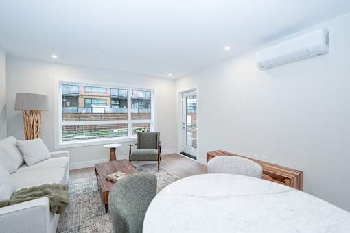 Living Room and Dining Area at Woodland Place Apartments, Langford, British Columbia