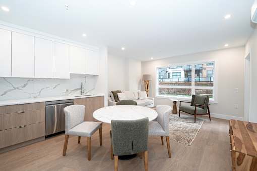 Kitchen with a Dining Table at Woodland Place Apartments, Langford