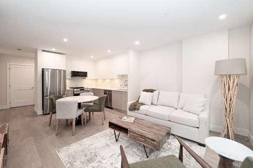 Living Room with a White Couch at Woodland Place Apartments, Langford