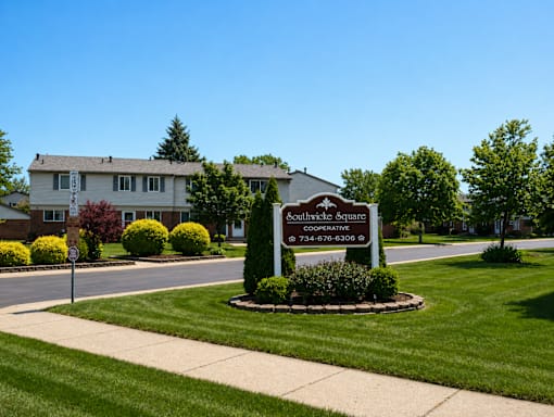 A sign for Southeast Square Cooperative is in front of a building.