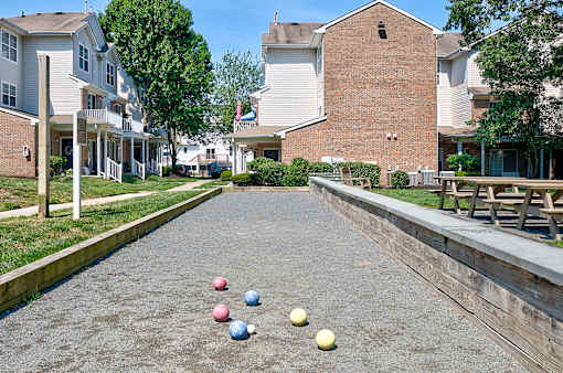 A bowling alley with 5 balls lined up in the center.