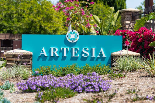 A blue sign with the word ARTESIA on it in white letters.