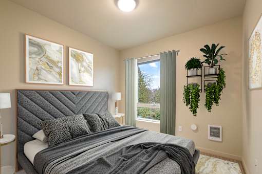 A bedroom with a large bed and a window with a view of the outdoors.