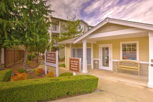 A sign in front of a house reads Valley Springs. at Valley Springs Apartments, Renton