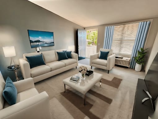A living room with a white sofa, a white armchair, and a coffee table.