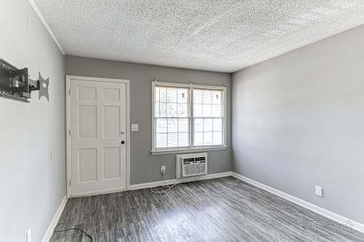 A room with a door and a window.