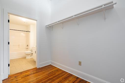 A white bathroom with a toilet and sink.