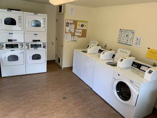 A laundromat with washers and dryers.