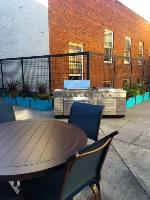 A table and chairs are set up on a patio.