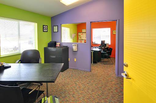 A room with a purple wall and a yellow wall.