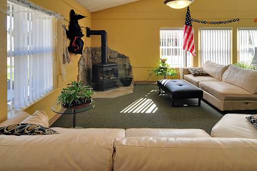 A living room with a fireplace and a couch.