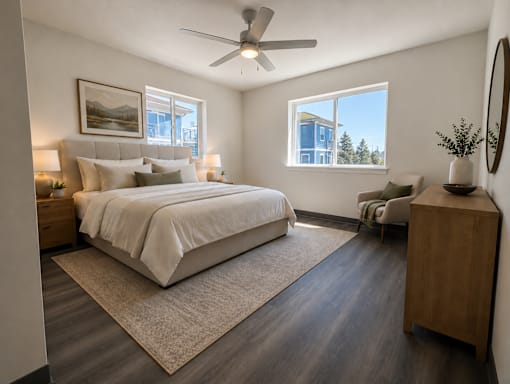 A bedroom with a large bed and a window overlooking a building.
