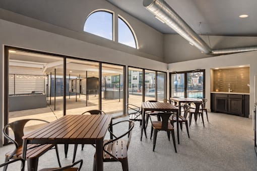 A room with a table and chairs and a window. at Infinity on the Landing Apartments , Euless, 76040