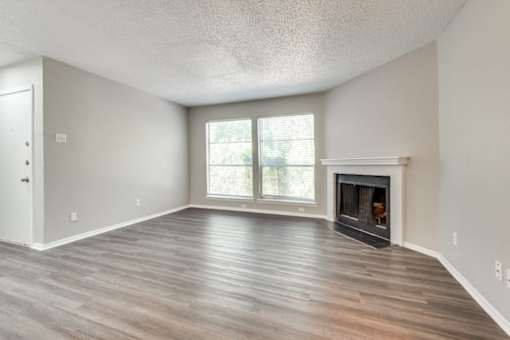 fireplace and a window at Infinity on the Oaks Apartments, Dallas
