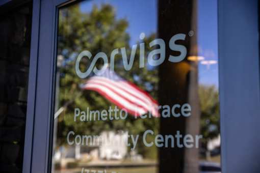 A window with a reflection of a flag and the word 
