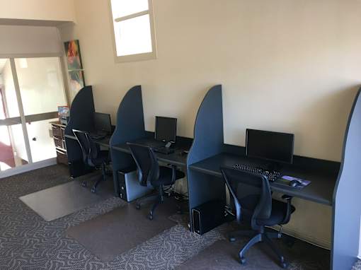 Computer Workstations with black chairs.
