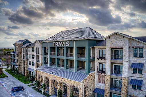 A large building with the word "TRAVIS" on it.