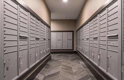 A long hallway with a row of lockers on each side.