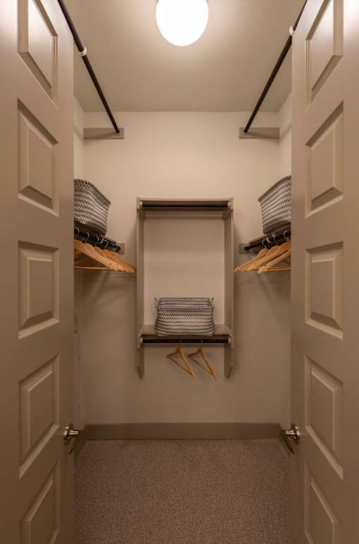 A hallway with a light on and a door on the left.